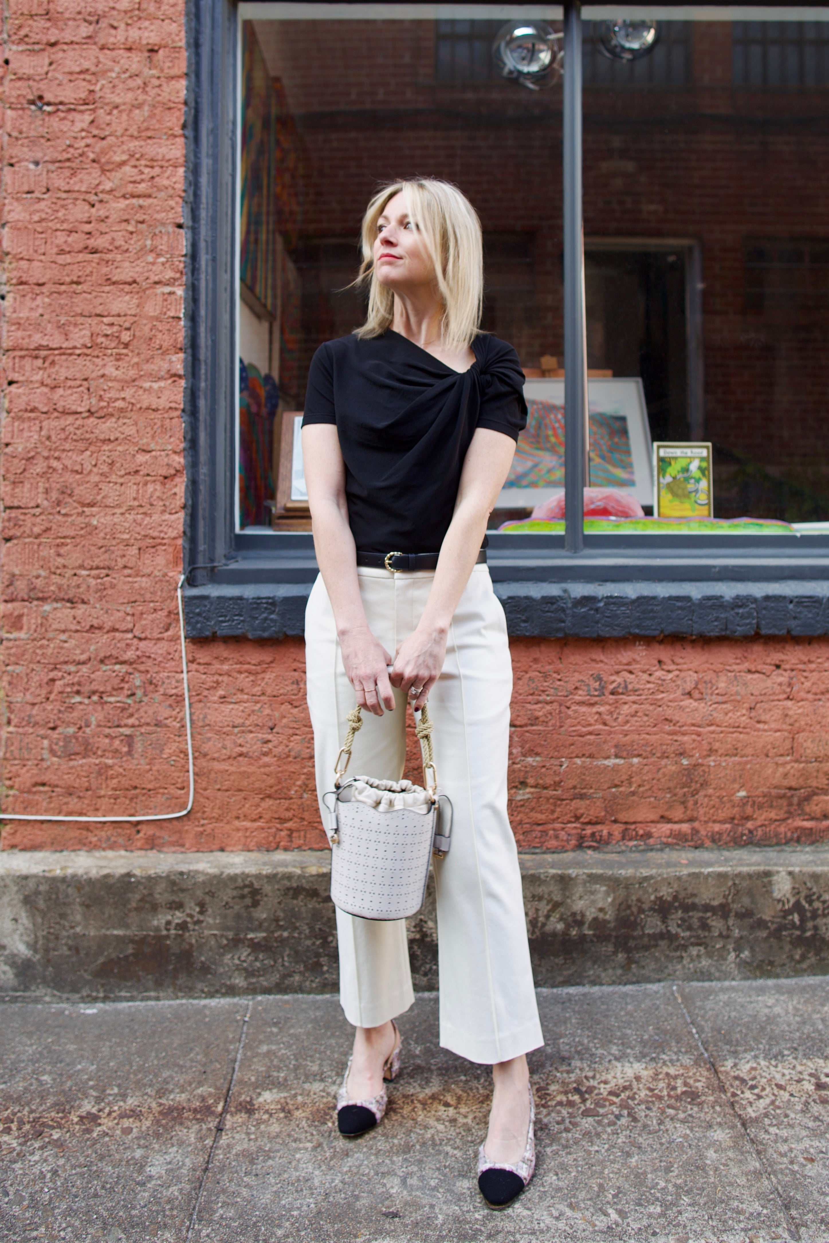 Mature women wearing luxury women's ALC Jay tailored trouser in cotton blend mid rise with straight, cropped leg and pintuck detailing