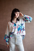 Image of a woman wearing the Alix of Bohemia Poet Juneberry Blouse and Ulla Johnson  Gwynne Jeans
