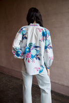 Back image of a woman wearing the Alix of Bohemia Poet Juneberry Blouse