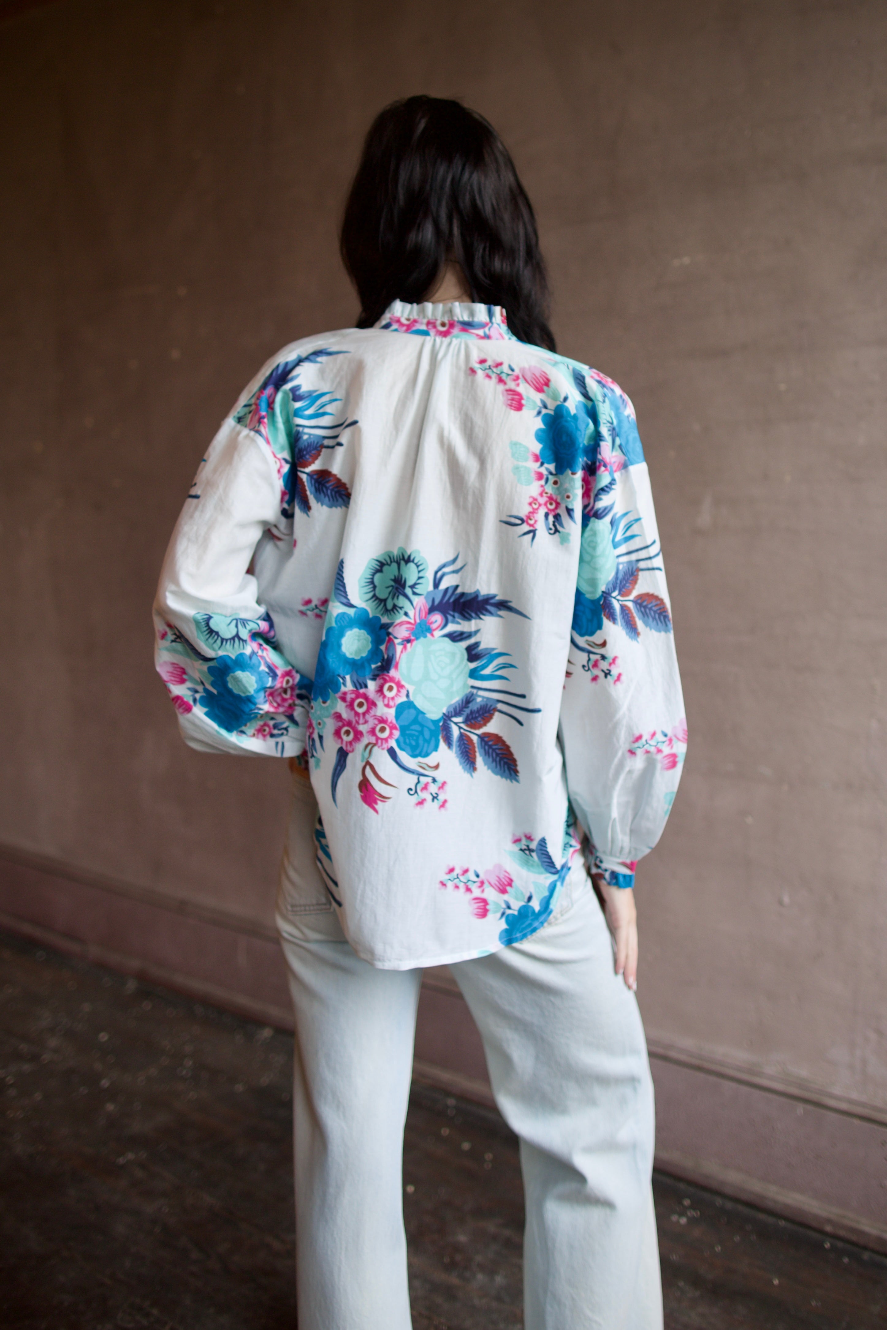 Back image of a woman wearing the Alix of Bohemia Poet Juneberry Blouse