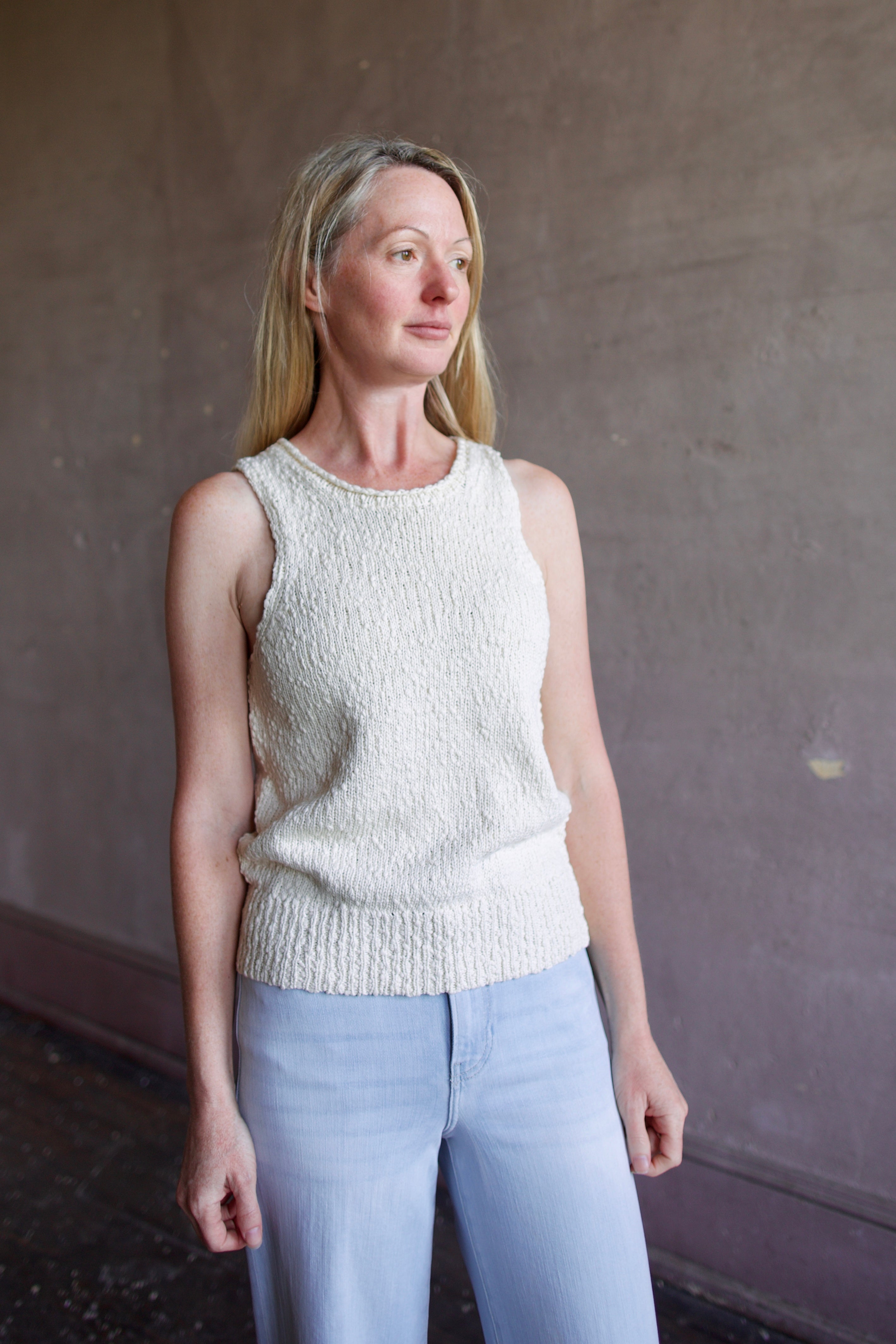 Image of a woman wearing the Apiece Apart Chiesa Vest