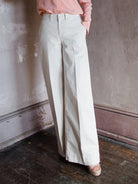 Image featuring a woman wearing the Frame Wide Leg Tomboy Khaki Trouser.