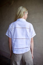 Back image of a woman wearing the Le Jean Linen Eyelet Shirt