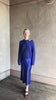 Video of Mature woman reviewing a vibrant royal blue silk bias cut midi skirt and matching cashmere knit sweater set