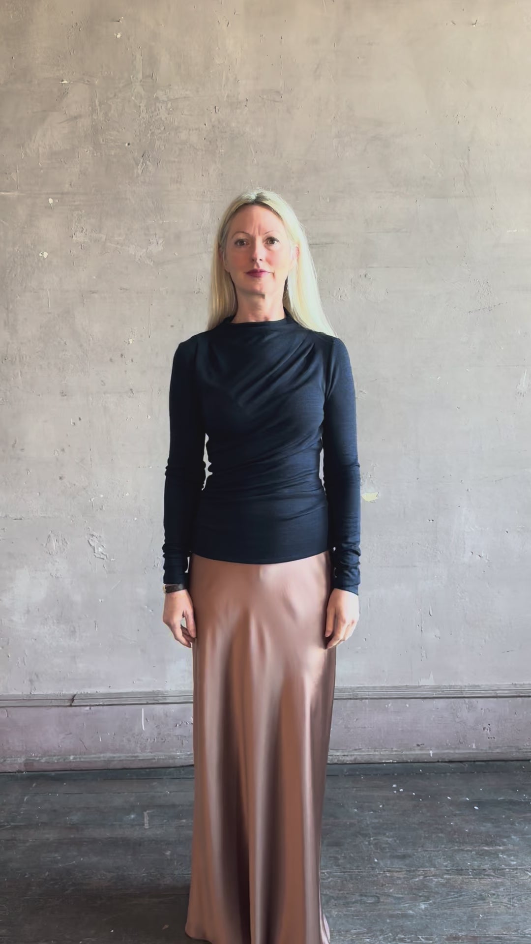 Video of woman reviewing Proenza Schouler WL Mini Jersey Top long sleeves mock neck slim fit with lots sculptural draping