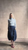 Video reviewing Rachel Comey dark wash denim midi Sobre skirt wrap-style front slit tulip design and side pockets