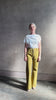 Mature woman reviewing ALC Alice cotton t-shirt with ruched side and shoulder detail that can be worn asymmetrically in bright white 