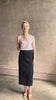 Woman reviewing lightweight premium Mongolian cashmere GUEST IN RESIDENCE Fine Stripe sleeveless Tank in red and blue stipes with scoop neck