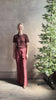 Mature woman reviewing premium polished layer SPRWMN classic brown wool tee shirt with crew neck and short sleeves and very light weight for a summer elevated basic or cool weather layering