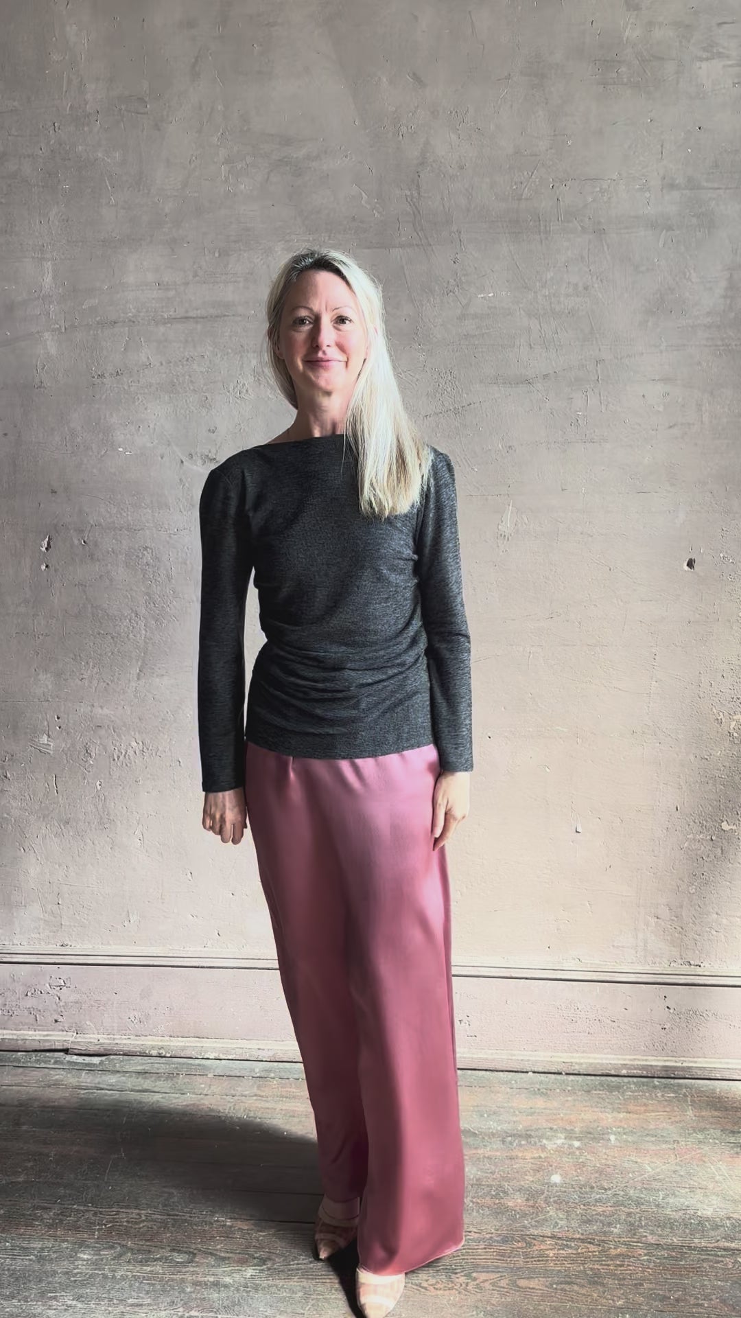 Woman wearing Proenza Schouler Blythe charcoal Top reversable long sleeves wool side ruching luxe draping