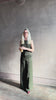 Video reviewing TWP high neck hidden placket vest top with matching pant set in a dark green linen viscose blend fabric