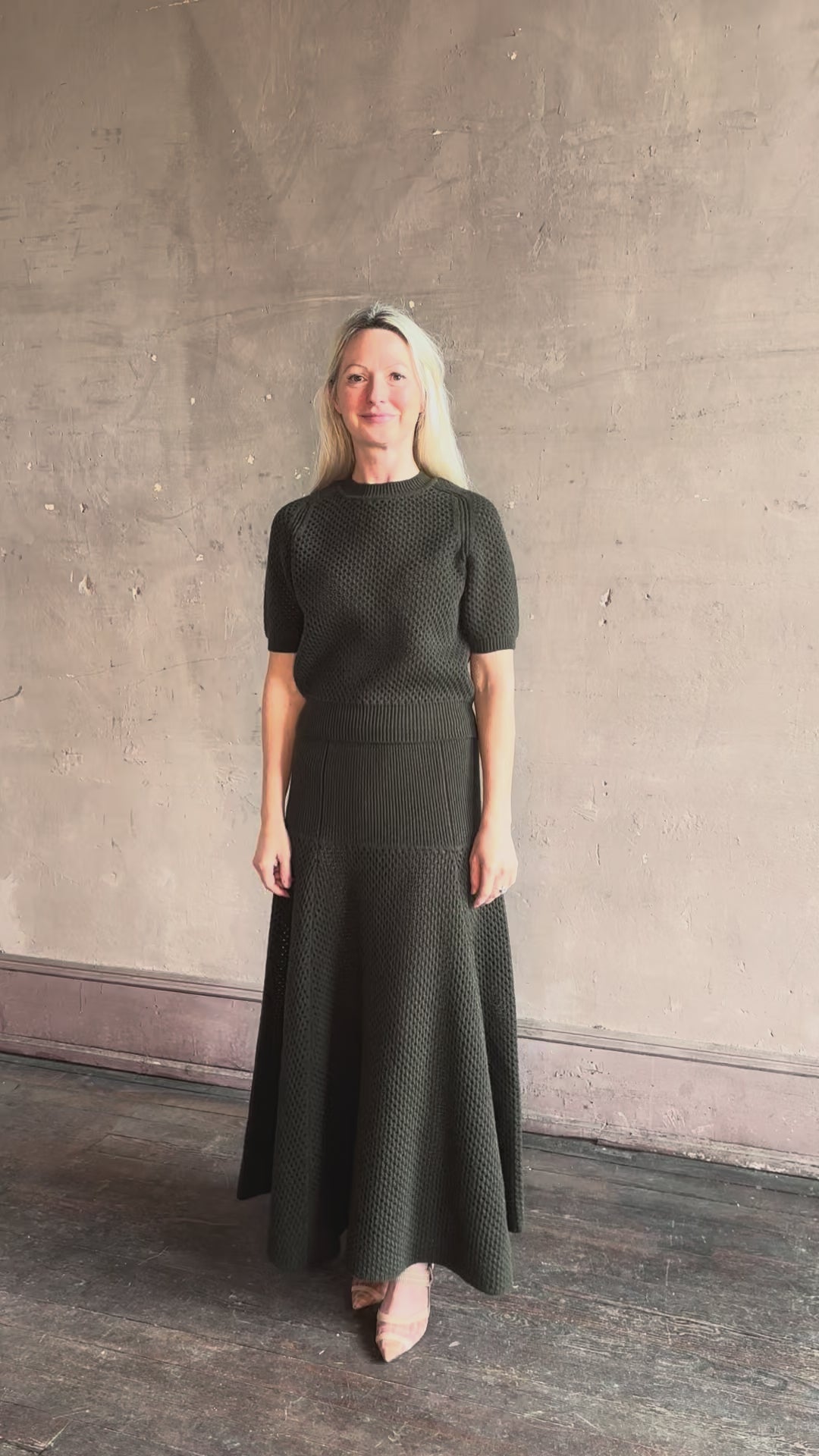 Video reviewing designer Ulla Johnson Imara Short Sleeve dark green Sweater with a dimensional open weave