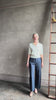 video mature woman reviewing quality TWP ivory short sleeve knit polo top ribbed texture collar henley 