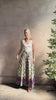 Mature woman reviewing Saloni Judi maxi plaid skirt with matching belt. This cotton A-line skirt is trimmed in pansies down front and bottom with front opening for additional ventilation