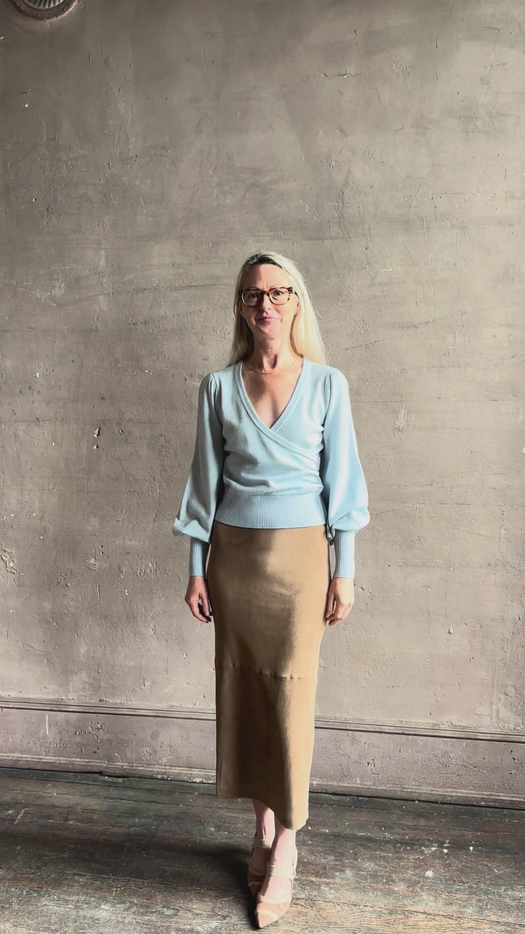 video reviewing designer Cara Cara wool-cashmere blend light blue wrap sweater v-neck and long sleeves
