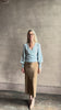 video reviewing designer Cara Cara wool-cashmere blend light blue wrap sweater v-neck and long sleeves