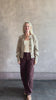 Video reviewing Nili Lotan’s Tribeca Pant in Cabernet: a cotton-elastane barrel leg with a relaxed fit and bar-and-zip closure. Made in the USA