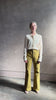 Mature woman reviewing Premium Baby Alpaca Mulberry Silk Calma shirt by Rachel Comey with button front, long sleeves and collar rendered in cream
