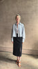 Mature woman reviewing premium lambskin leather TWP Little Big Joe button down cropped Shirt or Jacket in Kentucky Blue with long sleeves