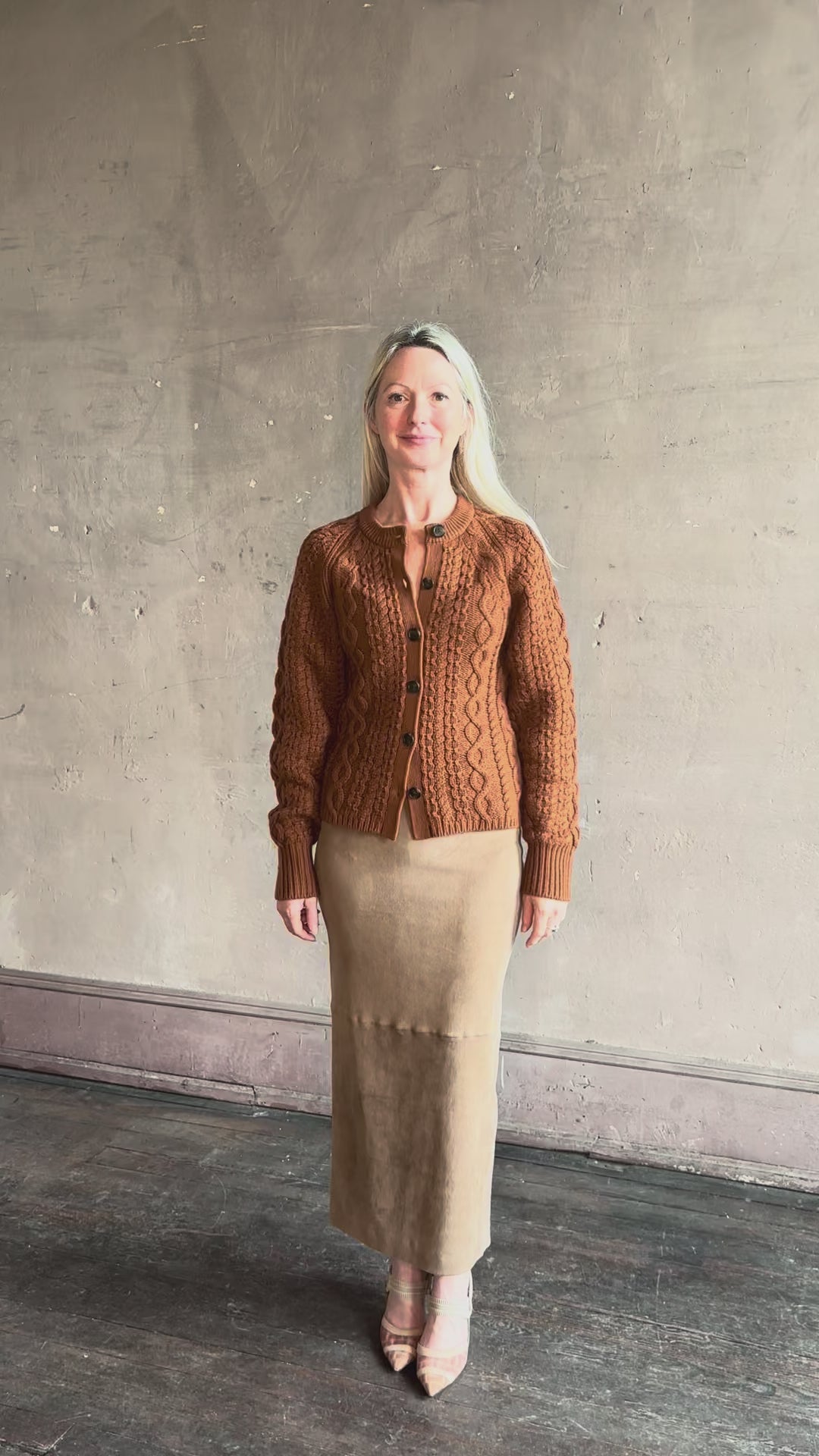 Video reviewing Guest in Residence's Cable Sculpted Cardigan Burnt Sienna wool-cashmere cable knit raglan sleeves. Richly textured heirloom-quality warmth