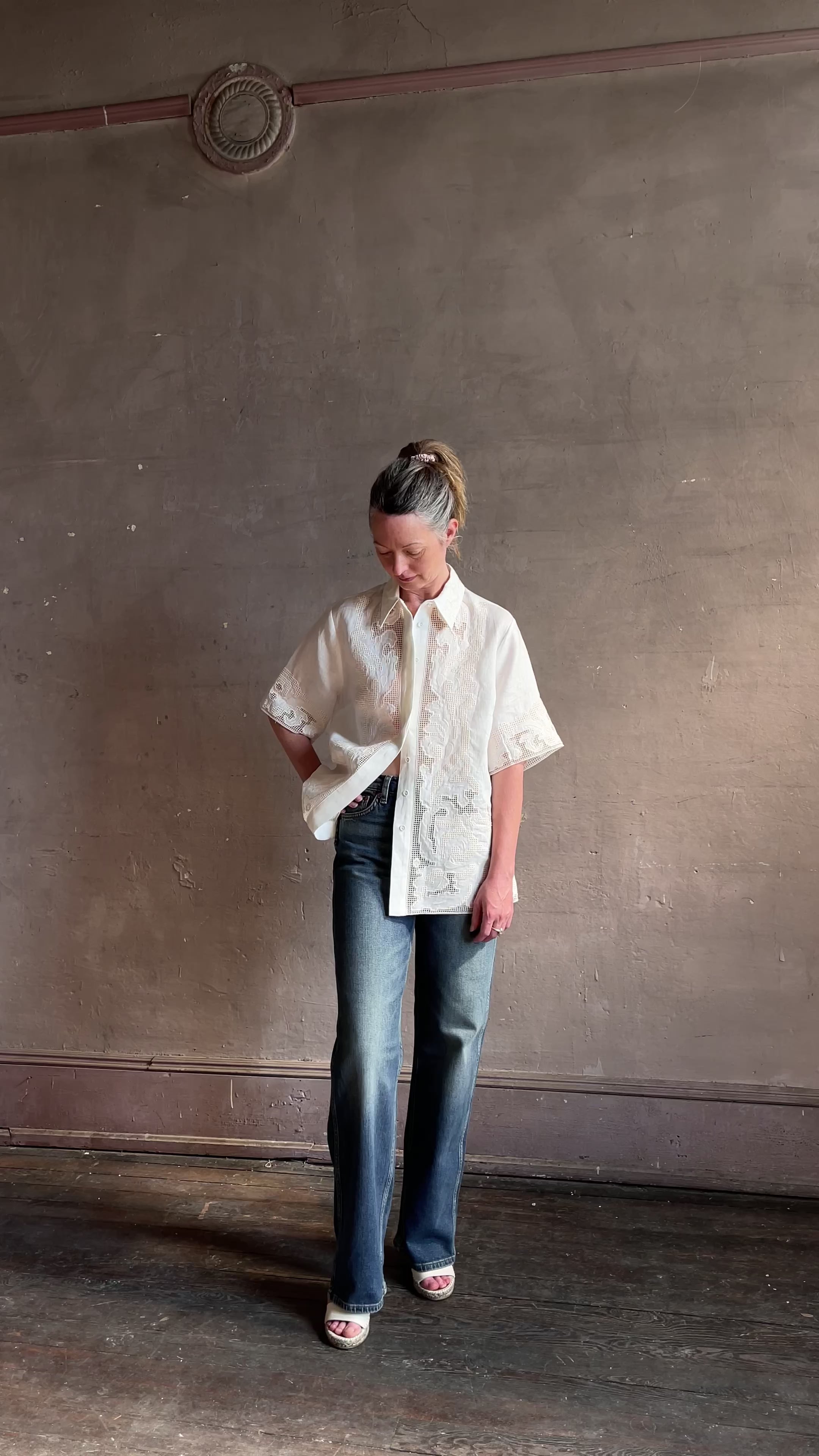 Image featuring a woman wearing with a point collar, dropped shoulder and embroidered cut out detail in European Linen.