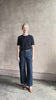 Woman reviewing AGOLDE Harper rigid cotton Denim in Reissue dark wash with a cropped finish hem and no distressing