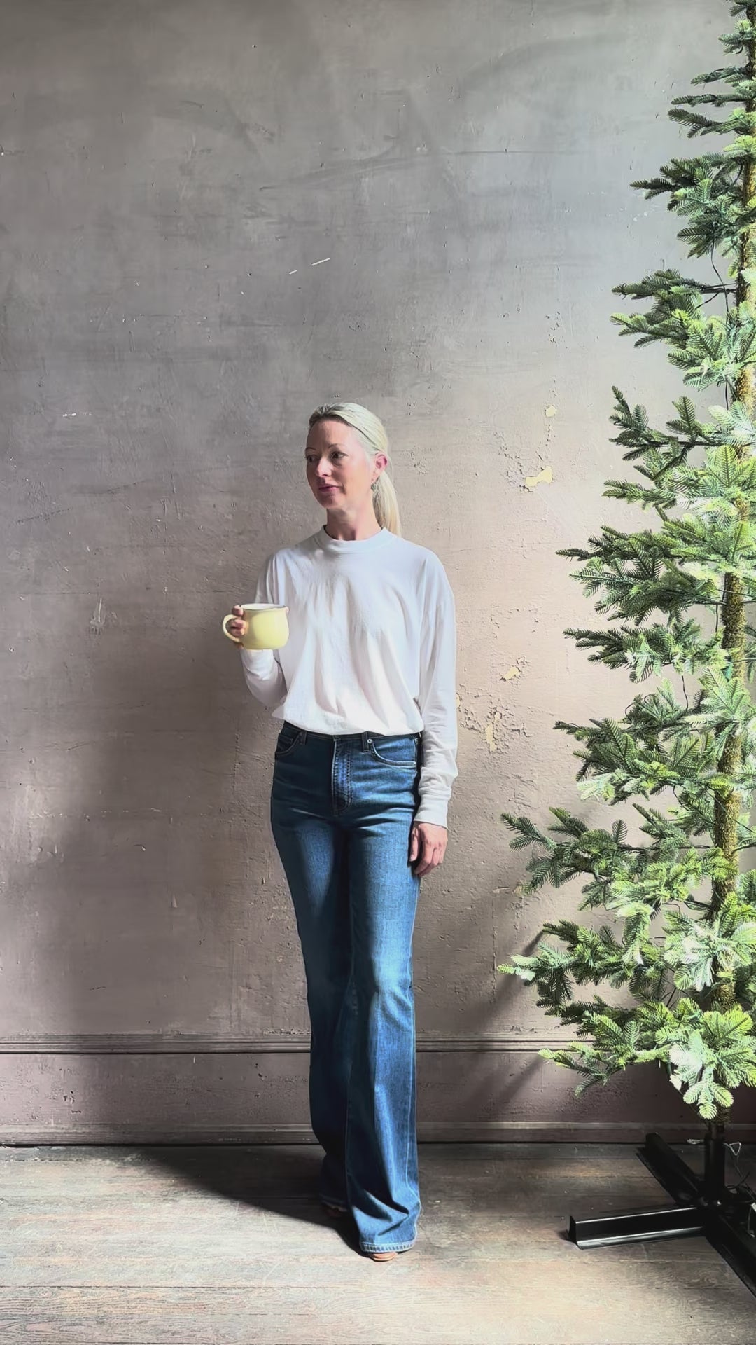 mature woman reviewing lightweight TWP from Premium Supima Cotton for exceptional softness with long sleeves and crew neck