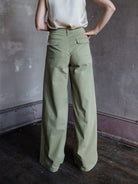 Image featuring a woman wearing the Rag & Bone Sofie Wide Leg Chino Pants in green