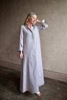 Image of a woman wearing the  TWP Jenny's Gown in Brown Stripe