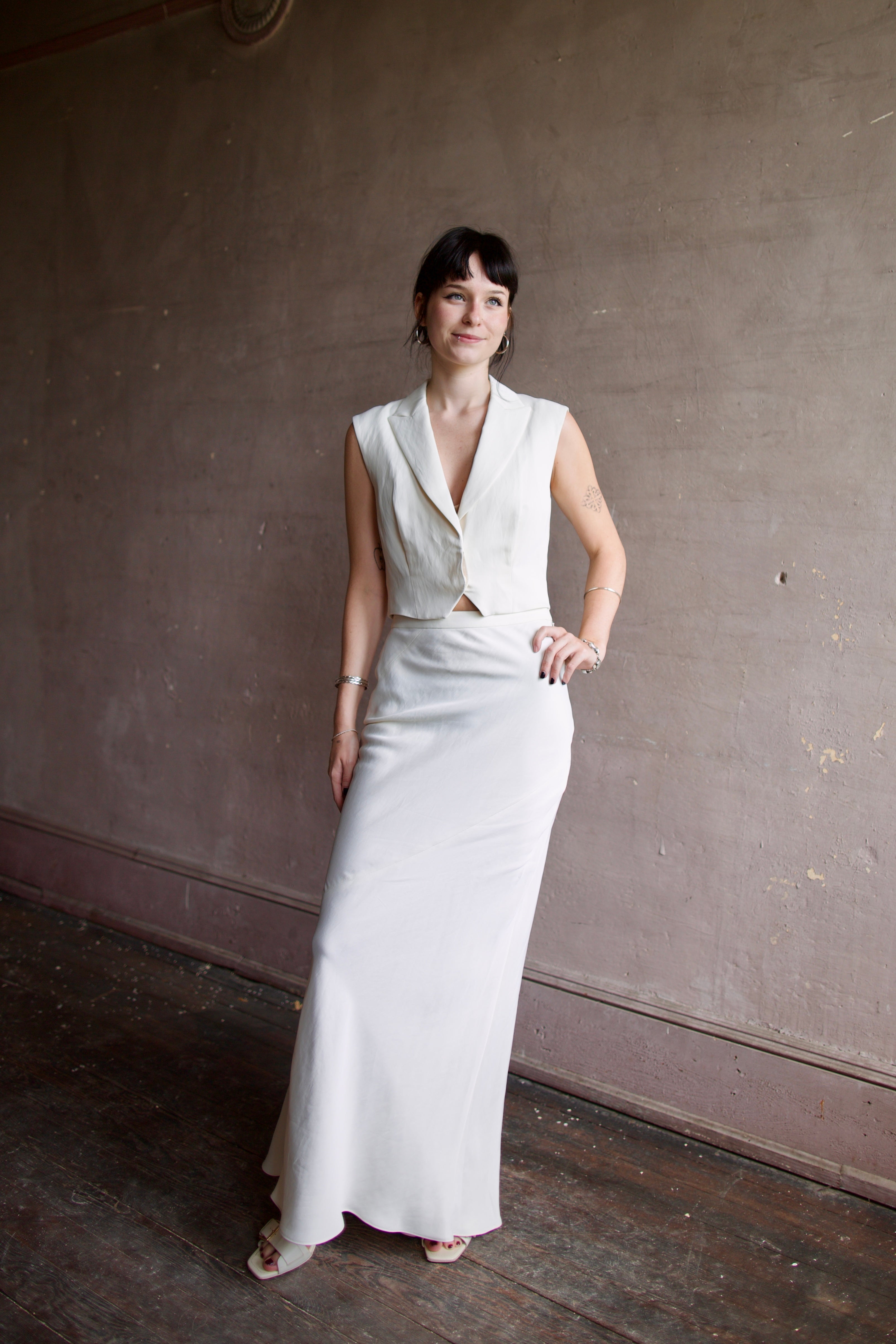 Image of a model wearing luxury TWP coated linen My Endless Love Skirt with expert tailoring for a sophisticated silhouette