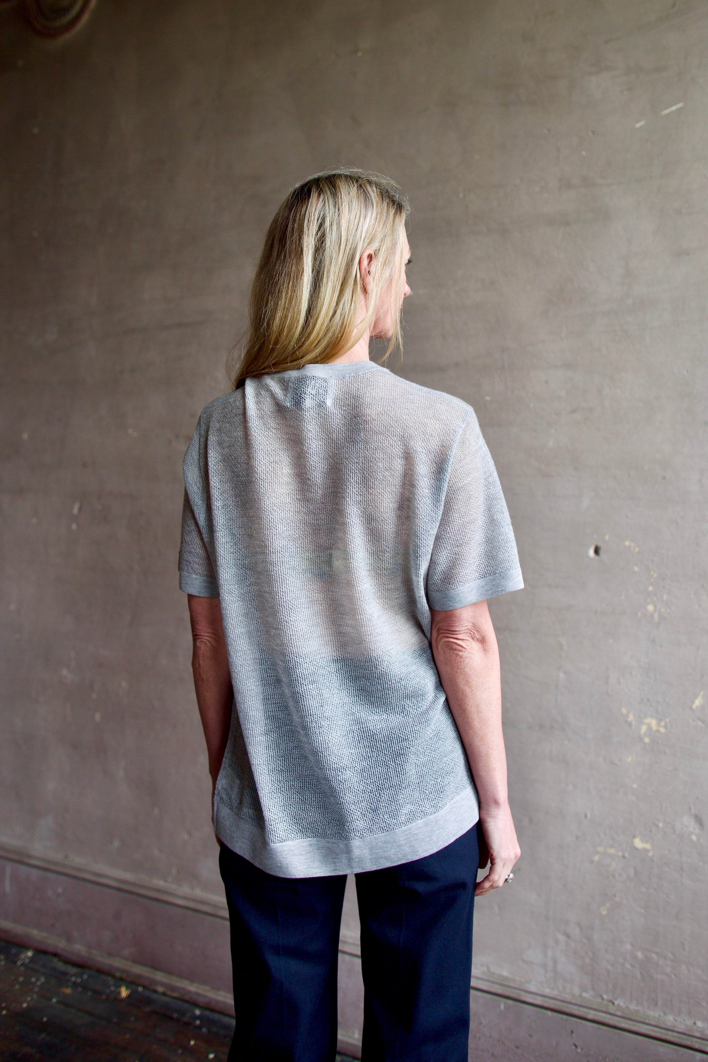 Back image of a woman wearing the TWP Knit Tee with Pointelle