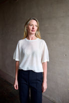 Image of a woman wearing the TWP Knit Tee with Pointelle in Ivory