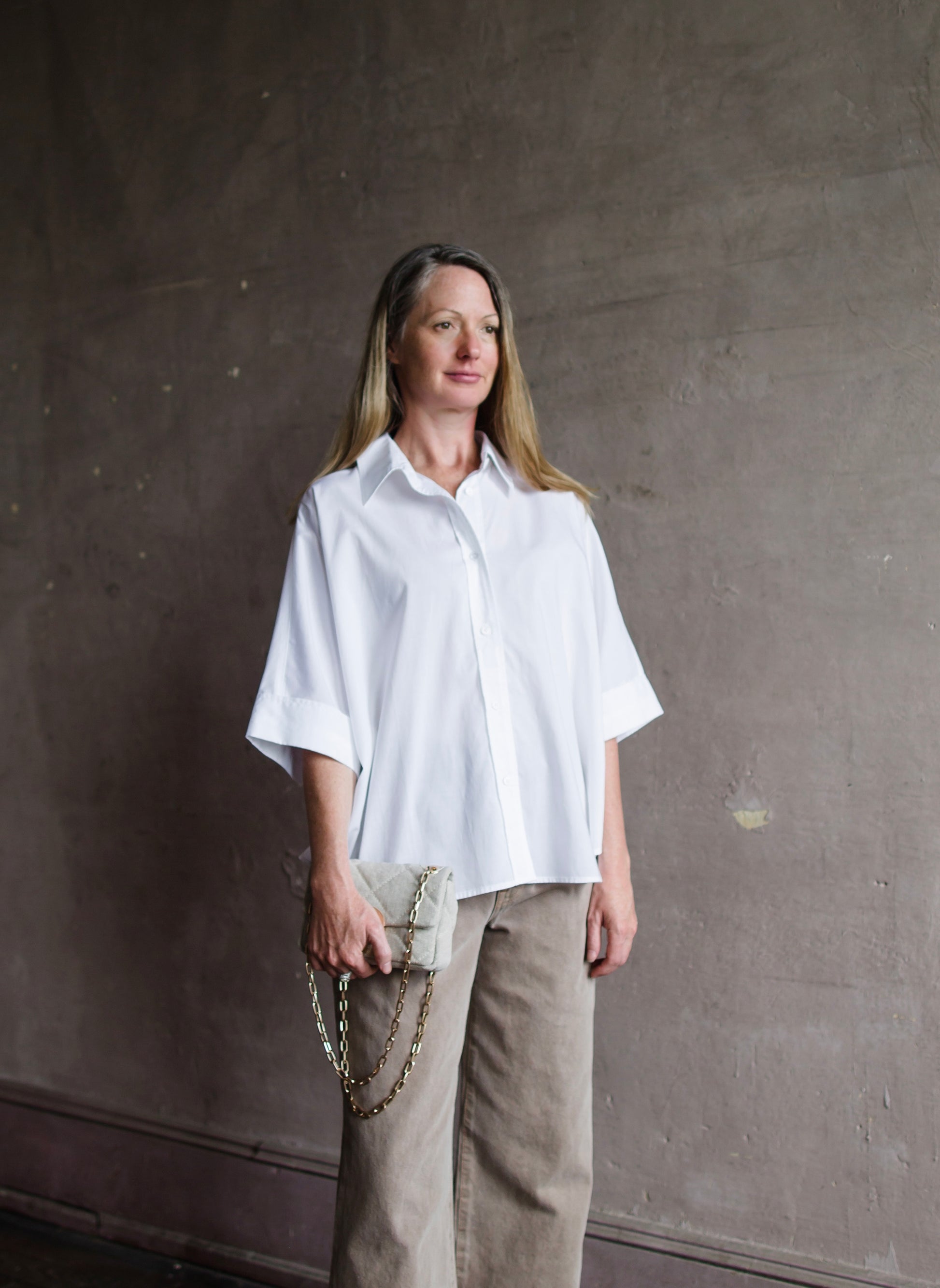 Image featuring a woman wearing he Bobby shirt by Vanessa Bruno features a button front and oversized, boxy fit.