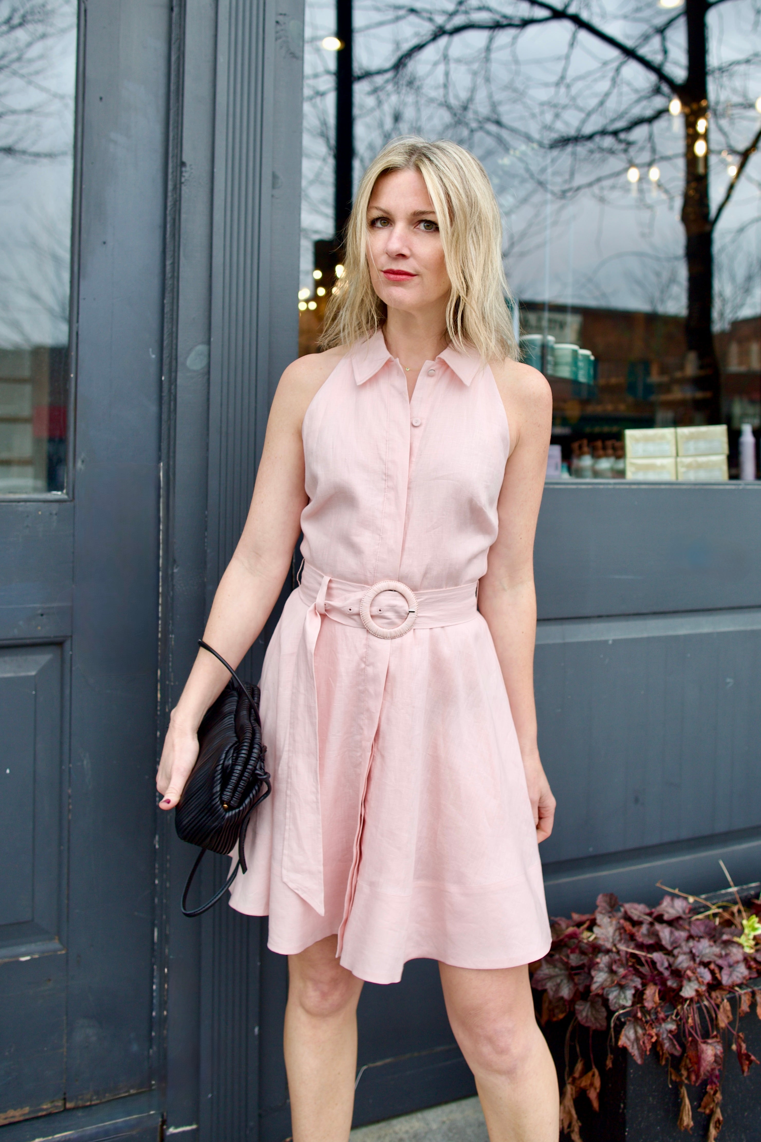 Mature woman wearing luxury women's Veronica Beard timeless linen Beau short dress with flowy skirt in expert American 