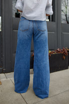 woman wearing Veronica Beard Kasey Jeans luxury women's cotton silk denim high rise and wide leg soft lightweight 